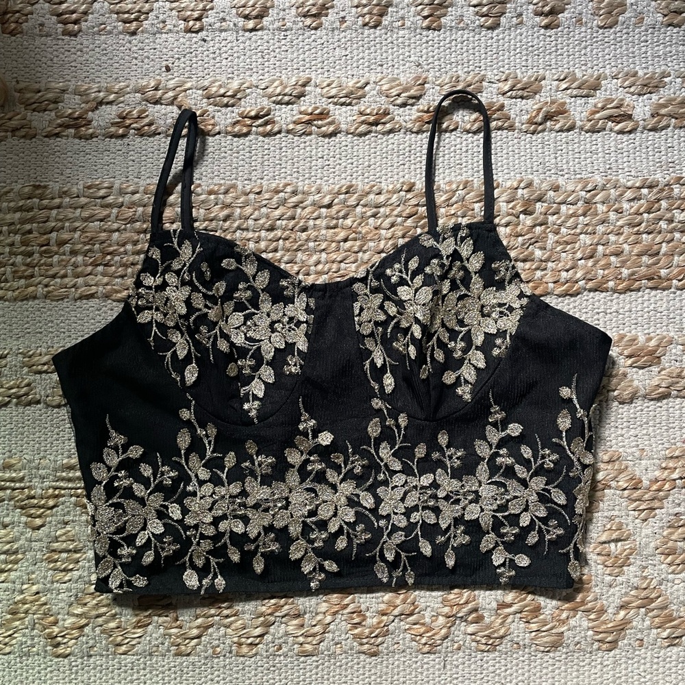 Black and gold zip up top